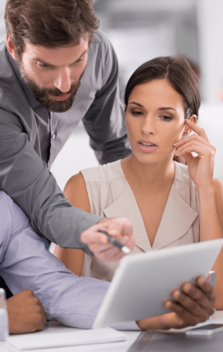 a-man-and-a-woman-discussing-on-laptop